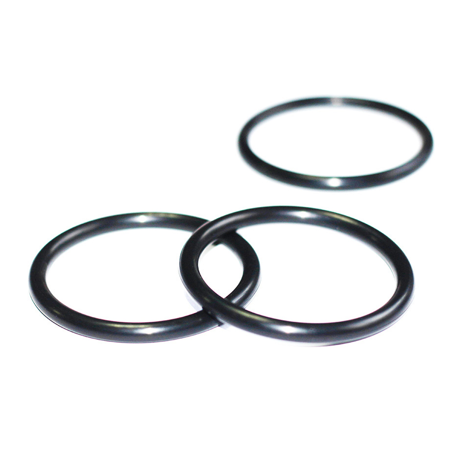 Three black NBR O-rings arranged on a white background, with two overlapping in the foreground